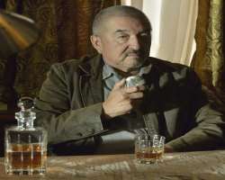 Graham Greene (Actor) consuming alcohol